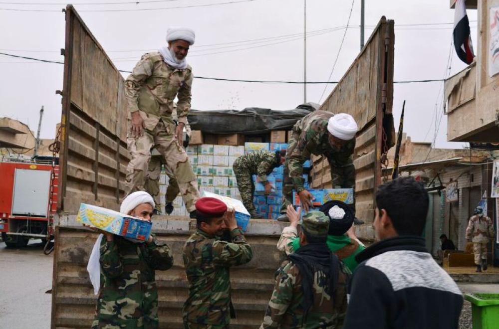 لجنة الارشاد والتعبئة للدفاع عن عراق المقدسات التابعة للعتبة العلوية المقدسة تقوم بايصال وتوزيع المساعدات الغذائية الى المجاهدين